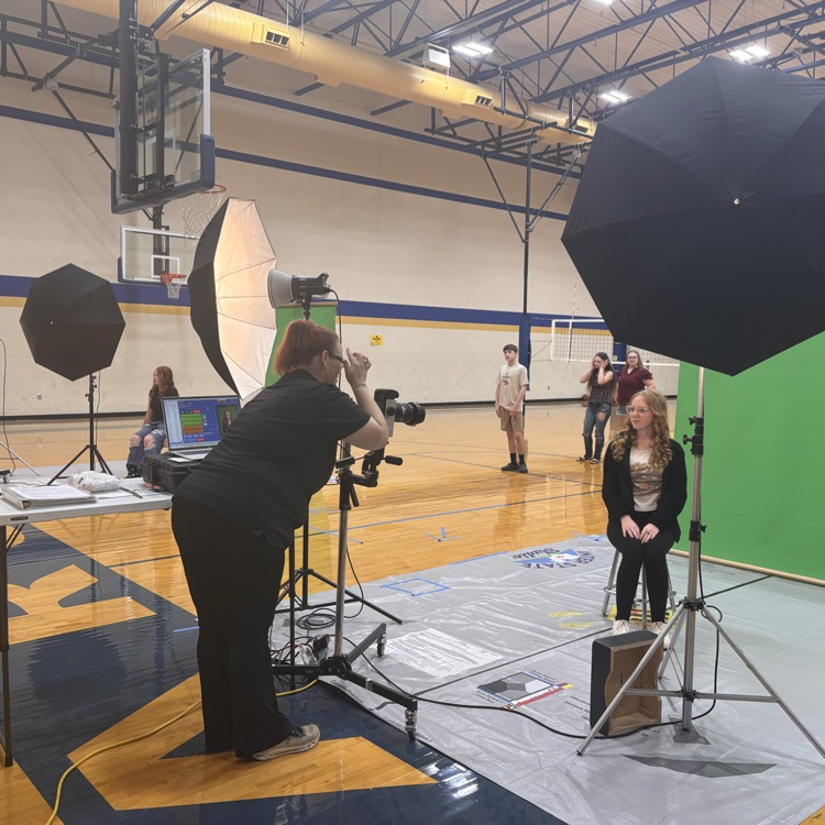 A student has her picture taken. 