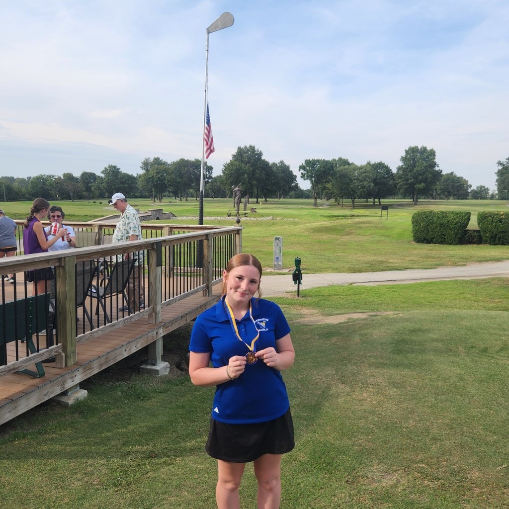 Kayleigh poaing with her 7th place medal.