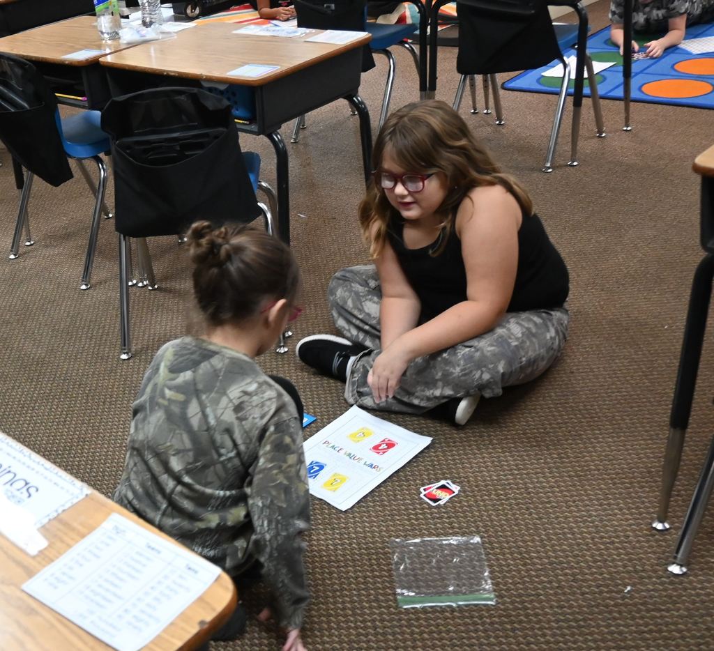 Two students play Place Value Uno