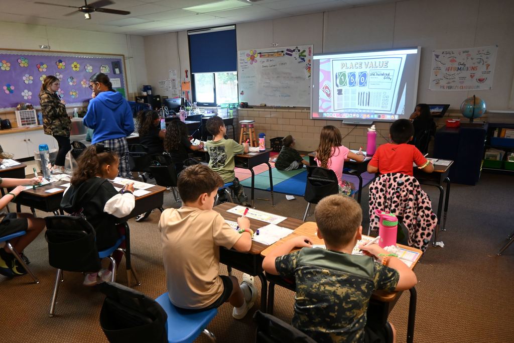 Students play place value wars.