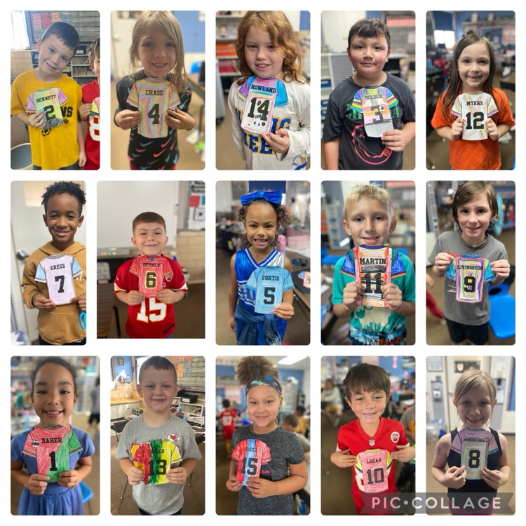 students with paper jerseys they personalized 