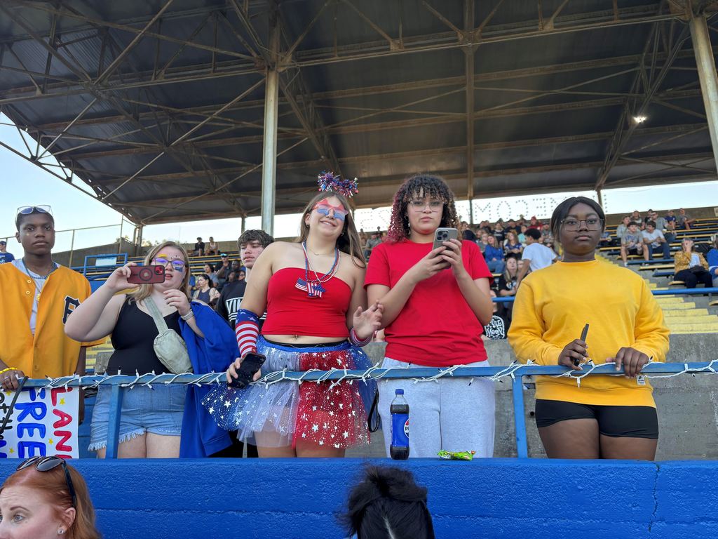 A student is dressed in red white and blue head to toe