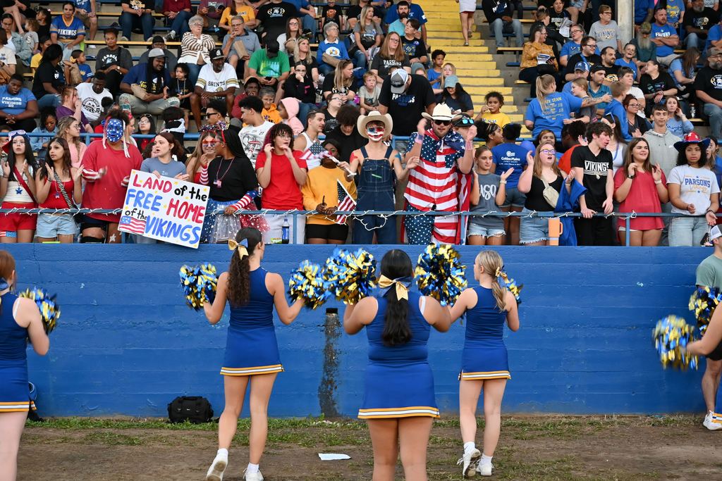 Fans chant with the cheer leaders.