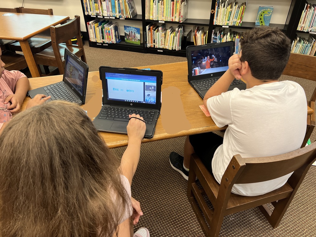 Students work at stations during library time this week. 