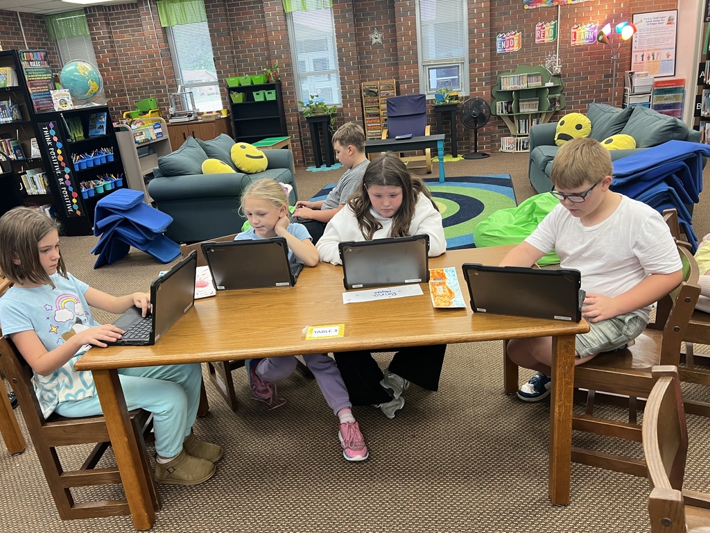 Students work at stations during library time this week. 