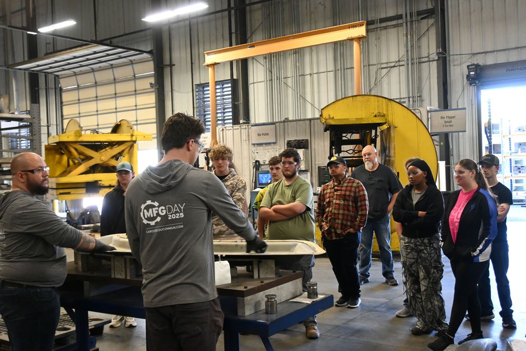 Two employees talk about the equipment used to manufacture parts, including one of the largest, most advanced  presses in the United States.