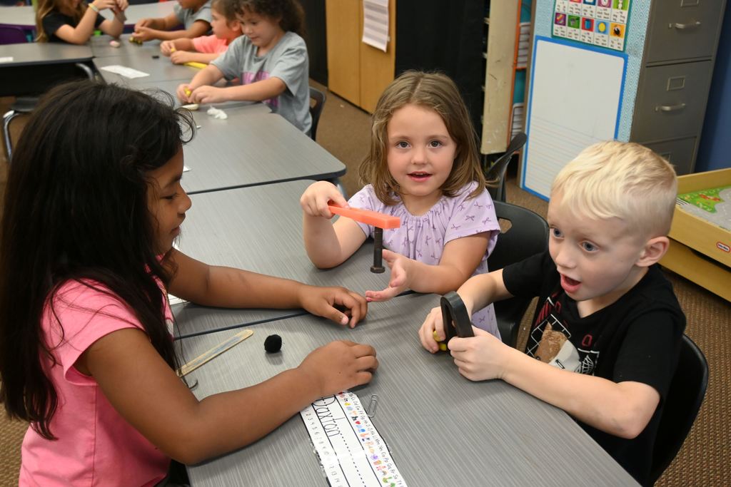 Students use magnets to learn about push and pull.