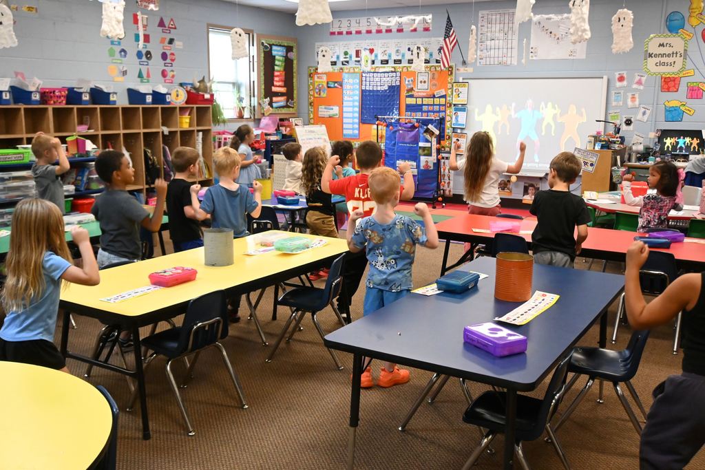 Students act out movements like push and pull.