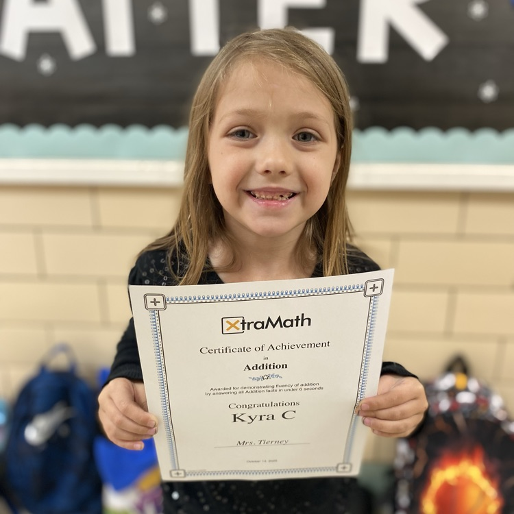 Student holding a certificate of achievement