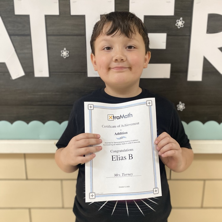 student holding a certificate of achievement