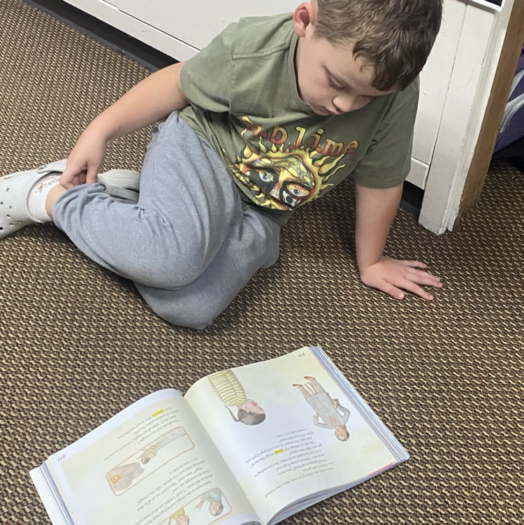 A student reading from his textbook