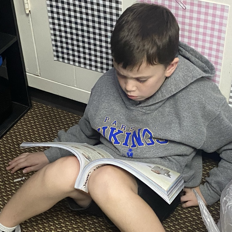A student reading from his textbook