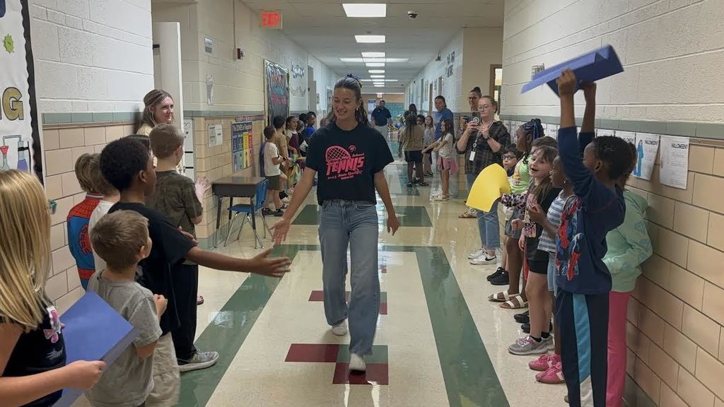 Kadence Ball walks the halls of Garfield where she is cheered on by students and staff.