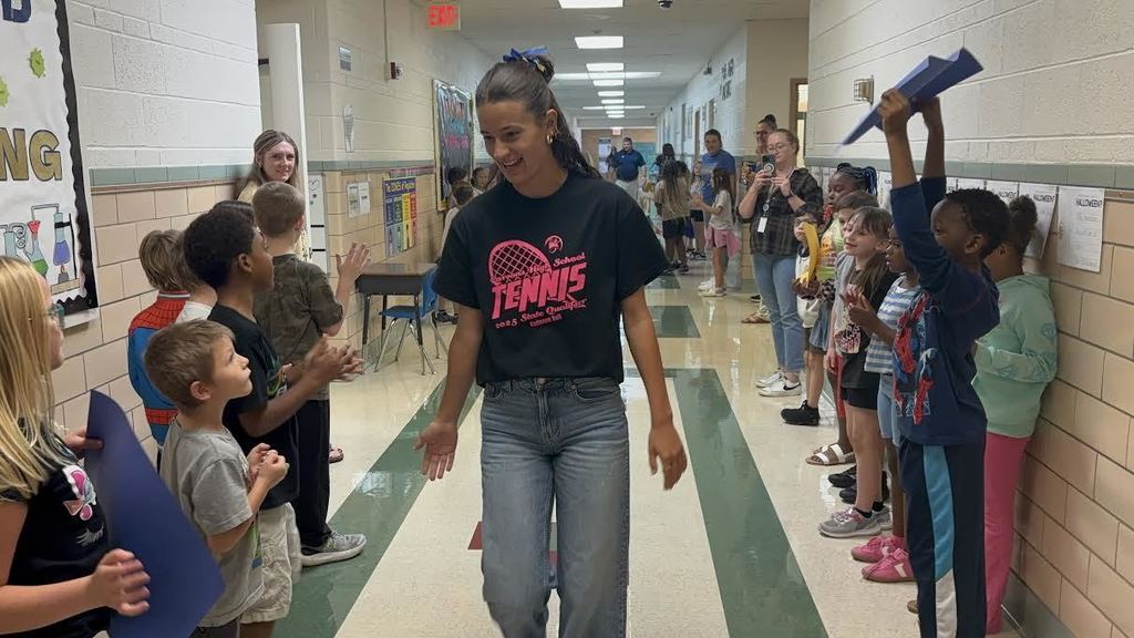 Kadence Ball walks the halls of Garfield where she is cheered on by students and staff.