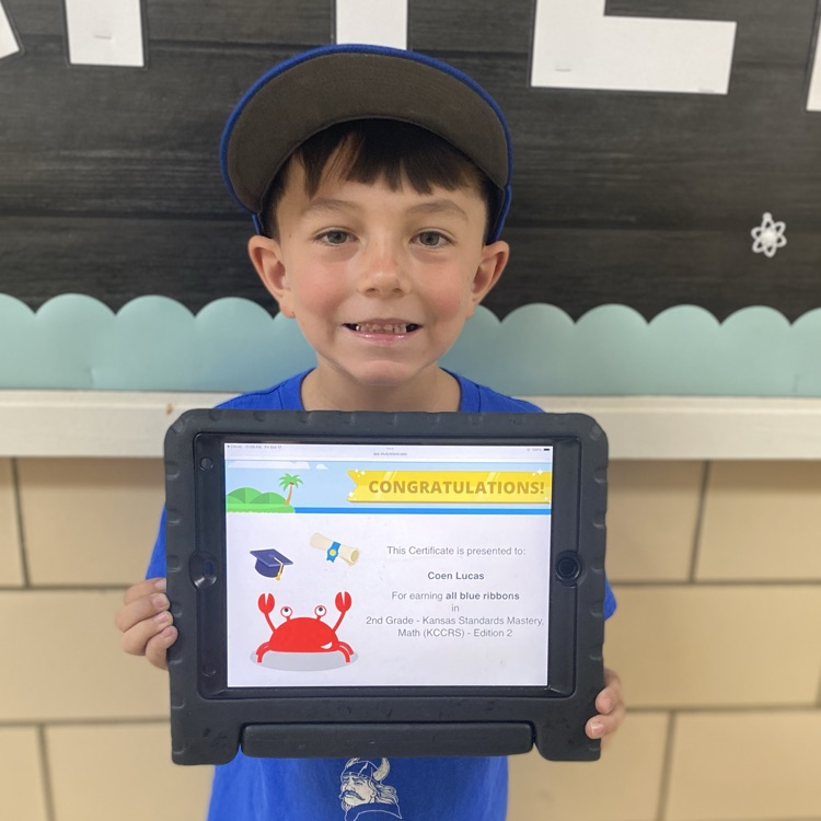 student showing a certificate of completion of a study island program