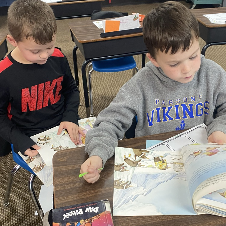 Two students reading together