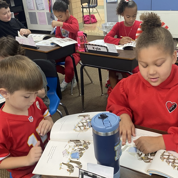 Two students reading together