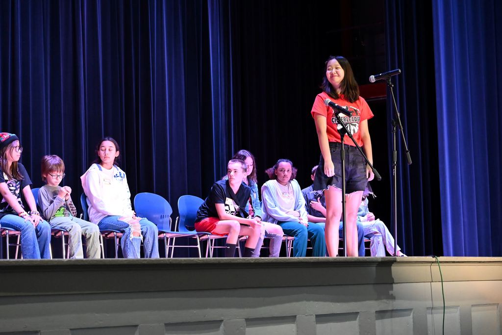A student spells a word for the judges.