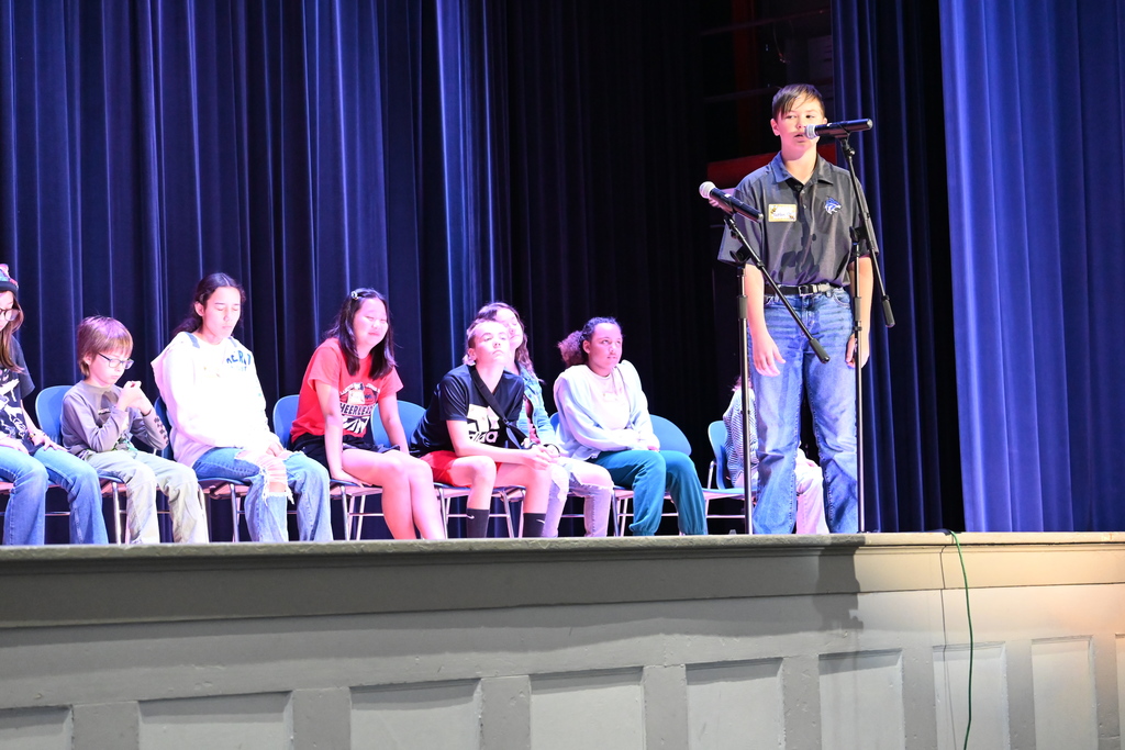 A student spells a word for the judges.