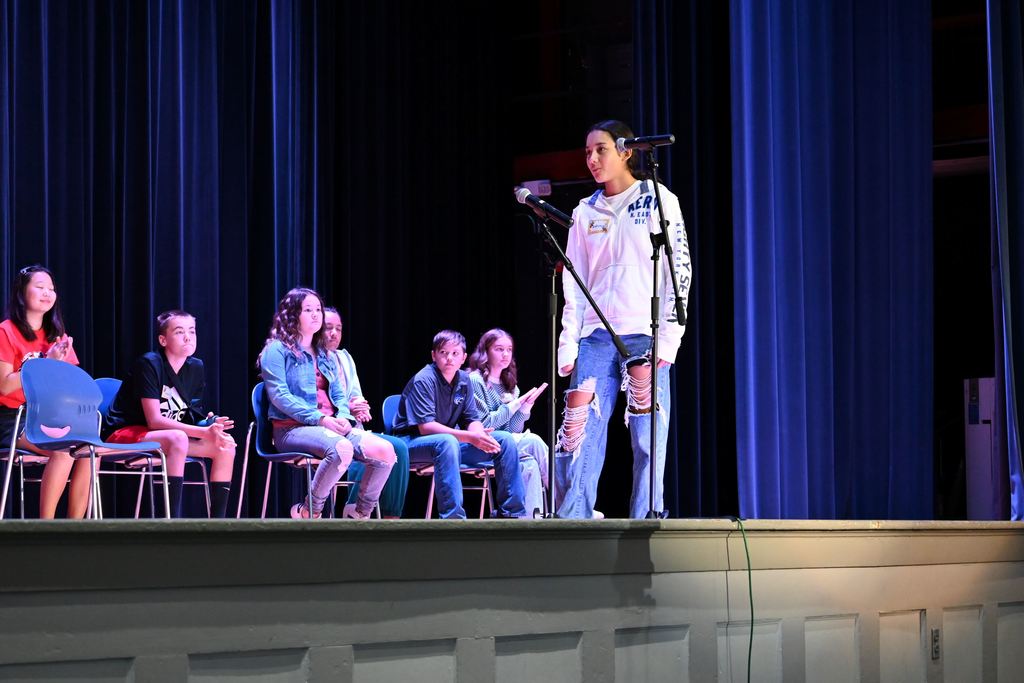 A student spells a word for the judges.