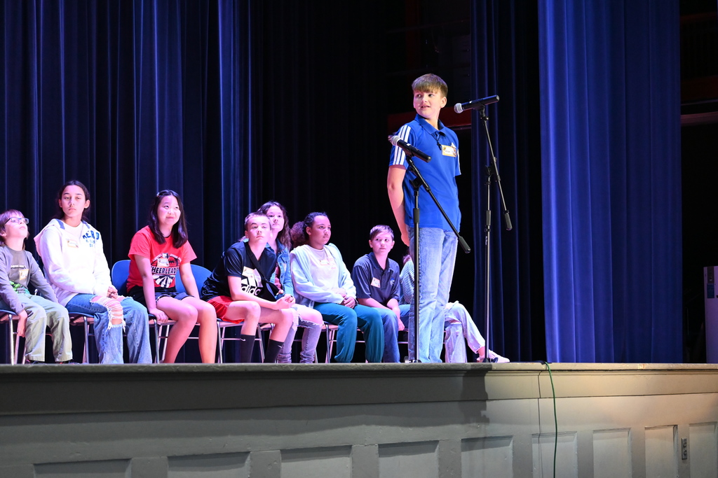 A student spells a word for the judges.