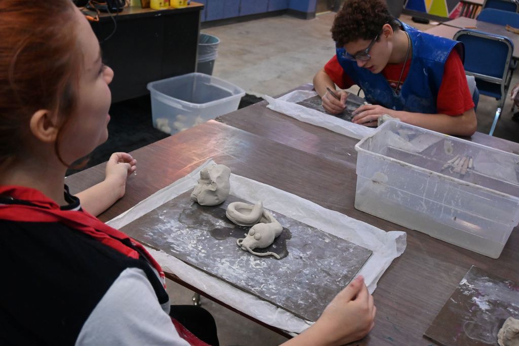 A girl talks to someone about her dragon.