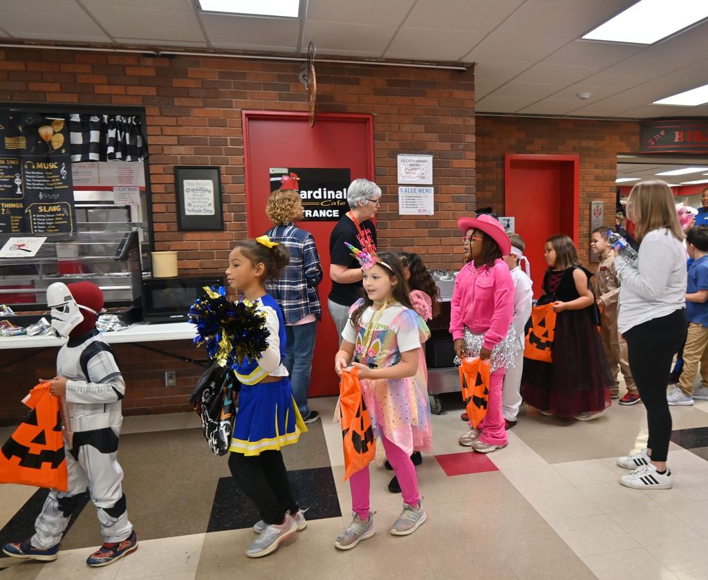 Students in costume receive treats from staff and students at LCC.