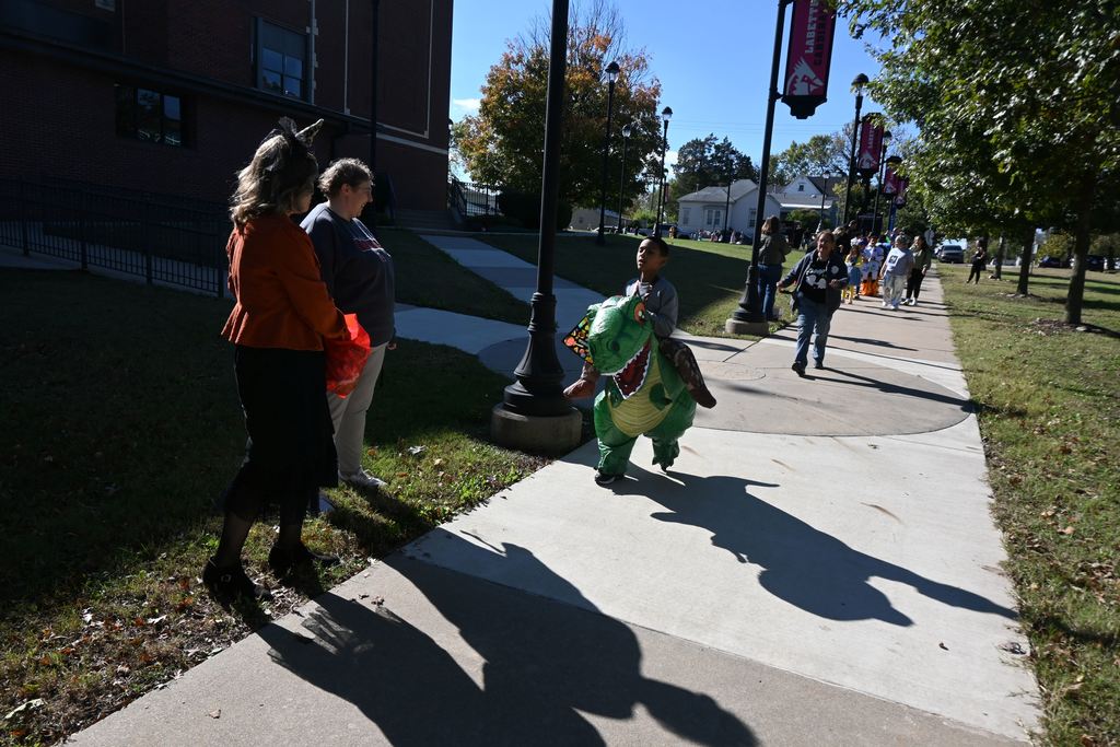 Students in costume receive treats from staff and students at LCC.
