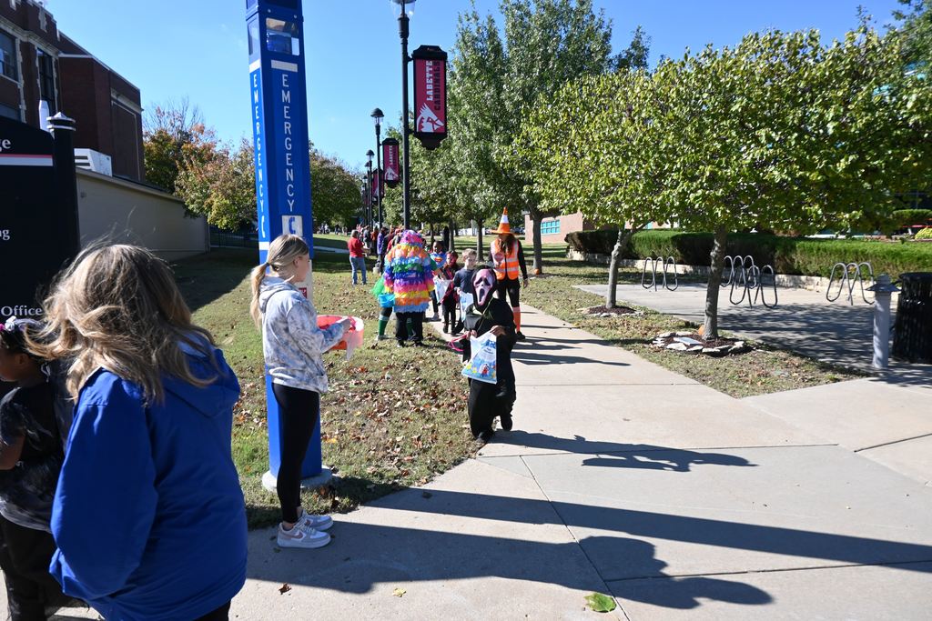 Students in costume receive treats from staff and students at LCC.