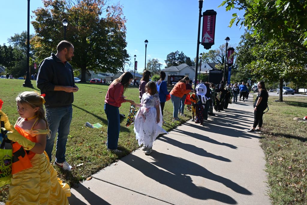 Students in costume receive treats from staff and students at LCC.