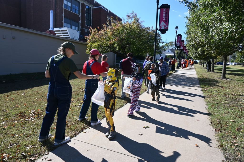 Students in costume receive treats from staff and students at LCC.