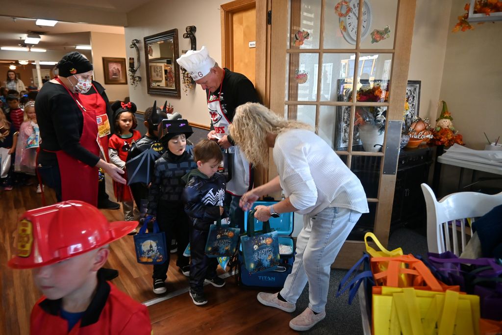 Children receive goodie bags as they leave.