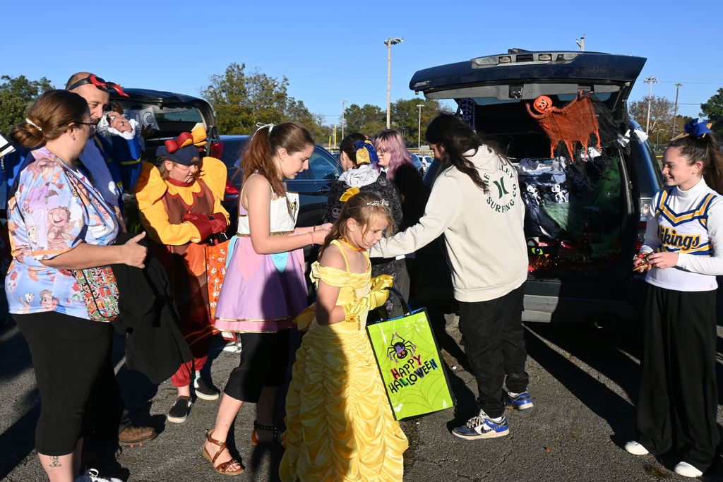 Students pass out candy.