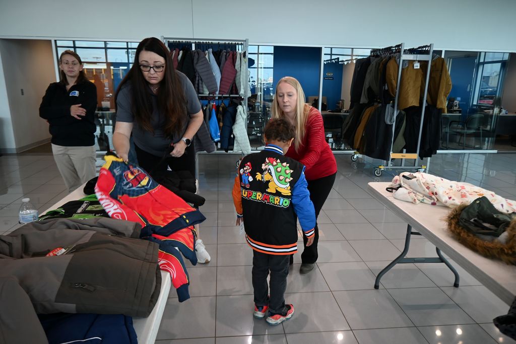 Tom Davis employees help students.