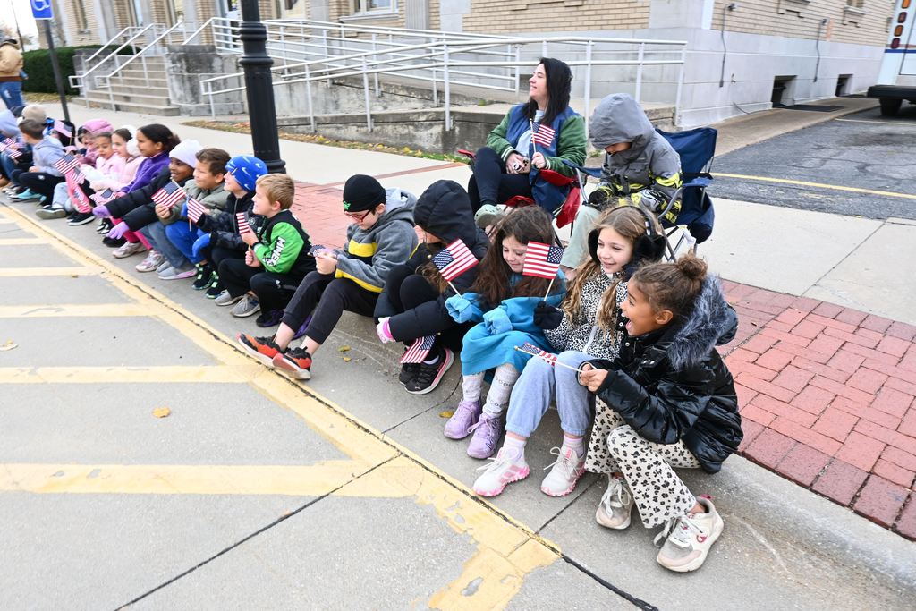 Garfield students line the curb in front of the post office for the parade.