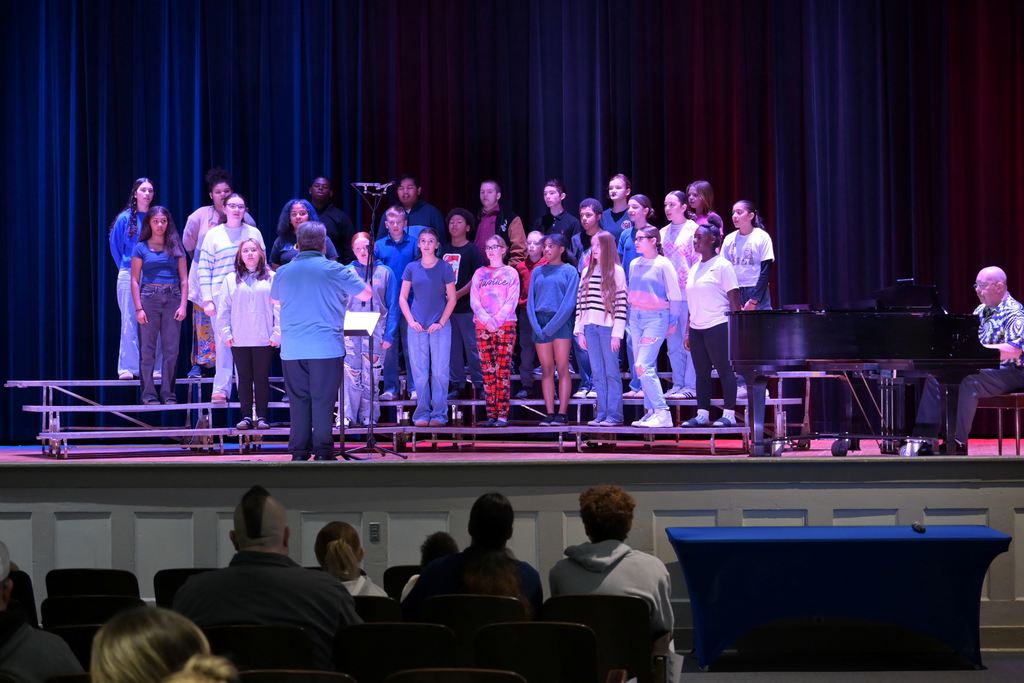 Middle School students sing a song about Veterans Day.