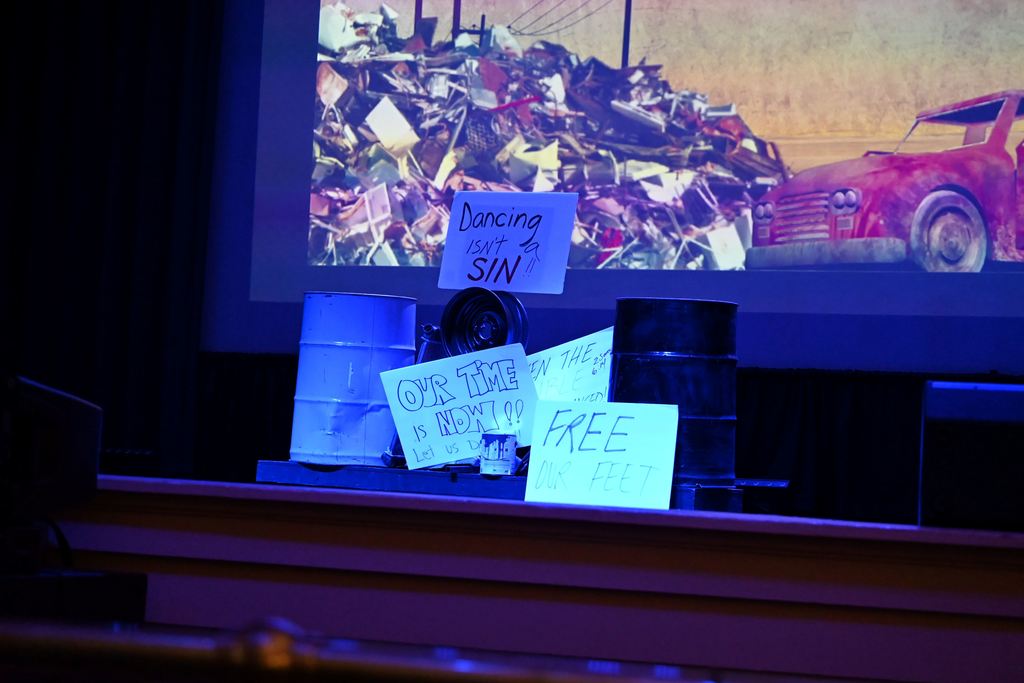 Student made signs saying "Dancing is not a sin", "Free Our Feet," and "Our Time is Now".
