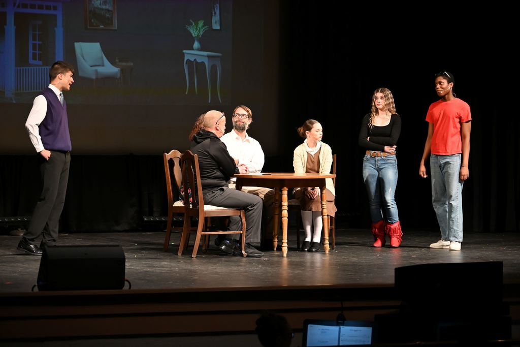 Rev. Shaw Moore talks to his daughter and Ren.