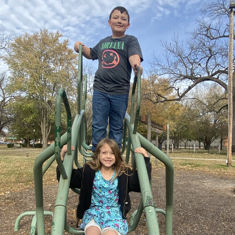 students on playground equipment 