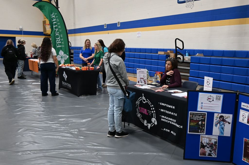 Students visit with businesses.