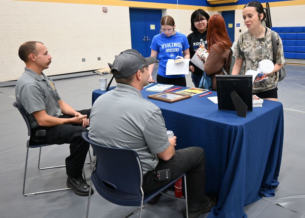 Students visit with firefighters.