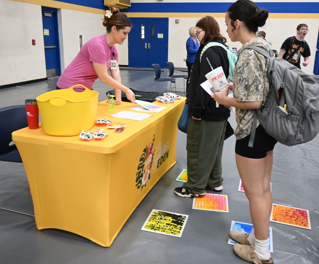 Students visit with someone from  Grow at Eden.