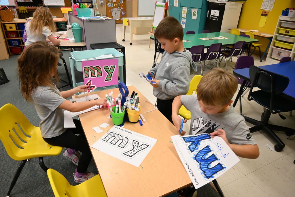 Children color and cut out the letters M and Y.