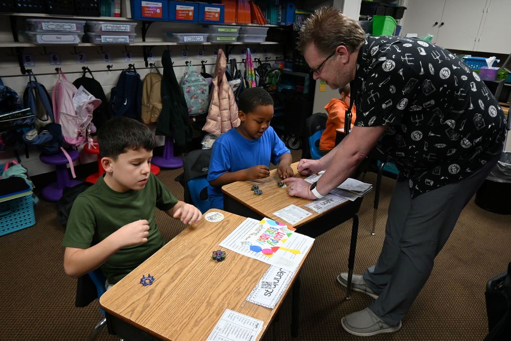 Mr. Peak helps students.