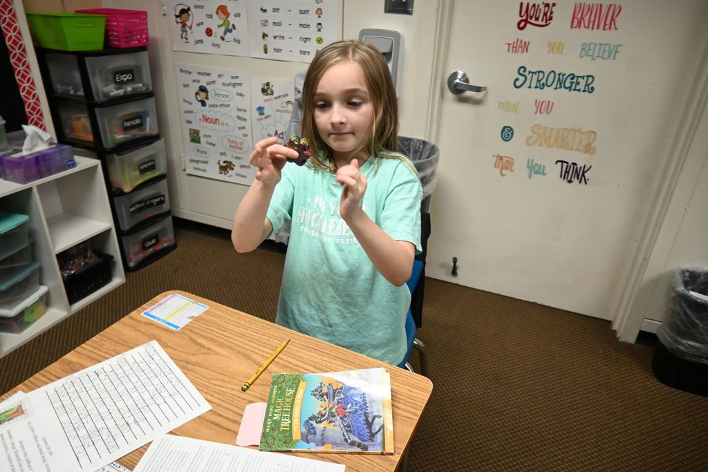 A student tests her spinner.
