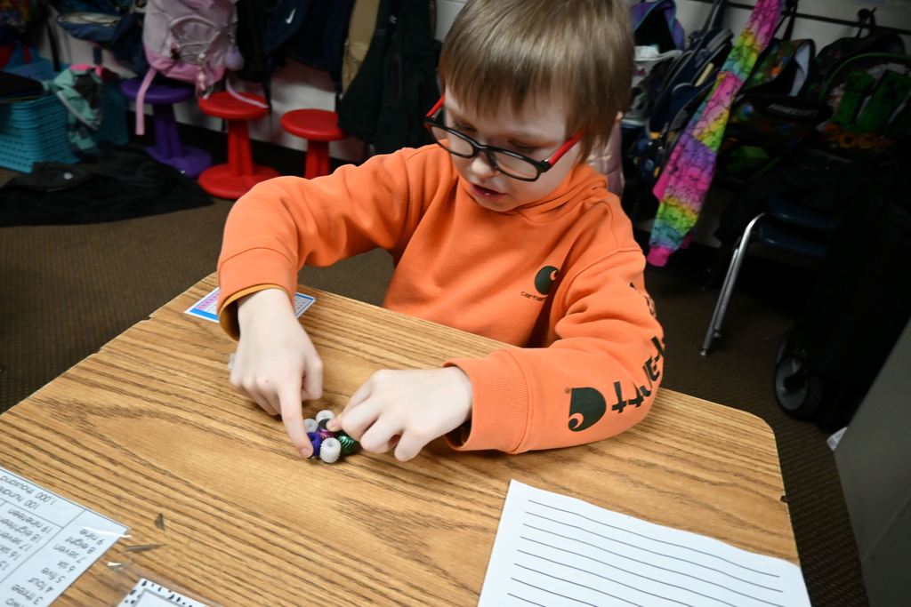 A student tests the gears on his spinner.