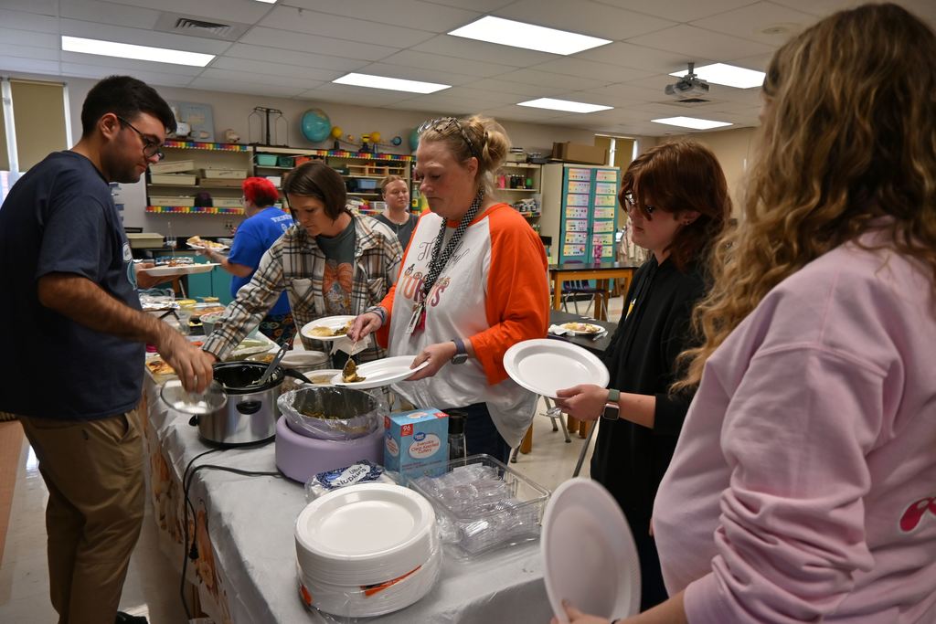 Guthridge staff enjoy a Thanksgiving dinner together.