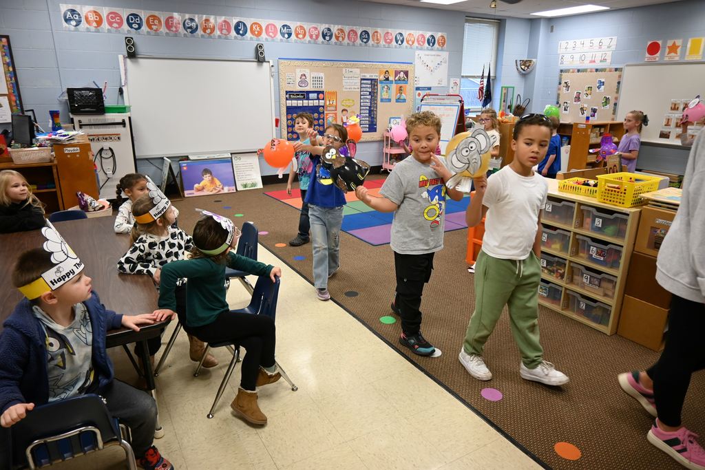 Guthridge first graders parade their balloons.