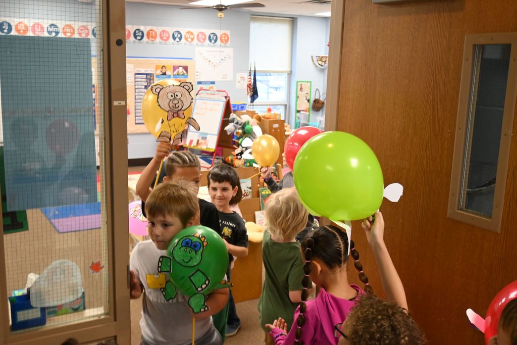 Guthridge first graders parade their balloons.