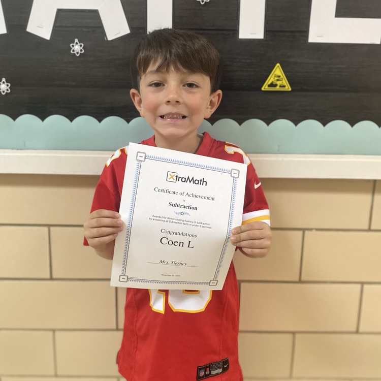student holding a certificate 